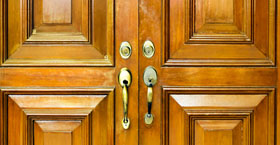 Wooden doors with brass handles
